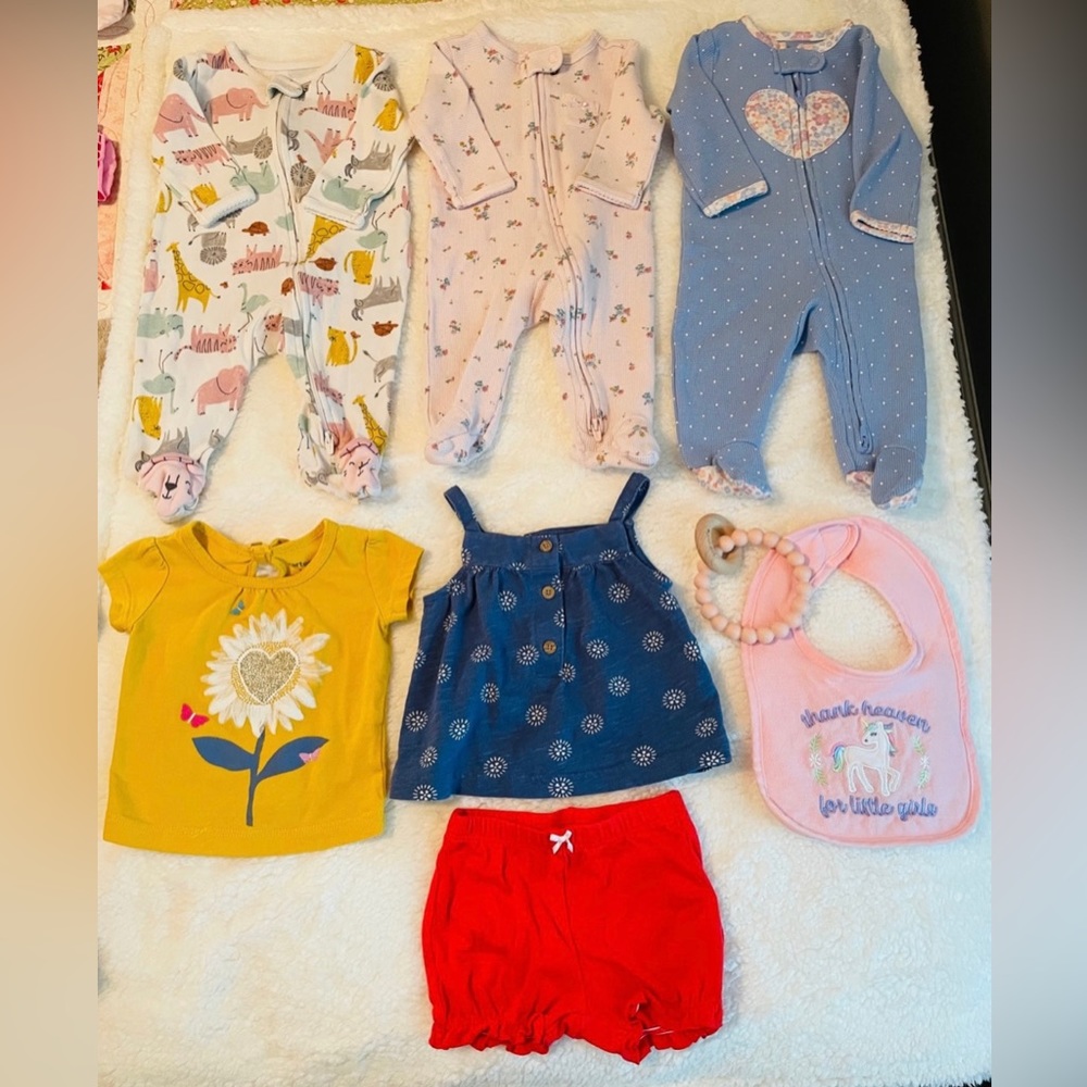 Lot of baby girl clothes, tags state 3 months or 3-6 months.